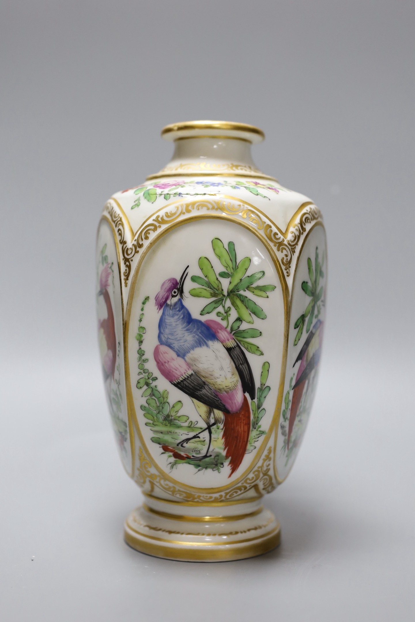 A late 19th century French porcelain vase, in Chelsea style, decorated with birds of paradise, 22 cms high